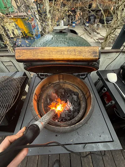 Lighting charcoal in a ceramic kamado grill