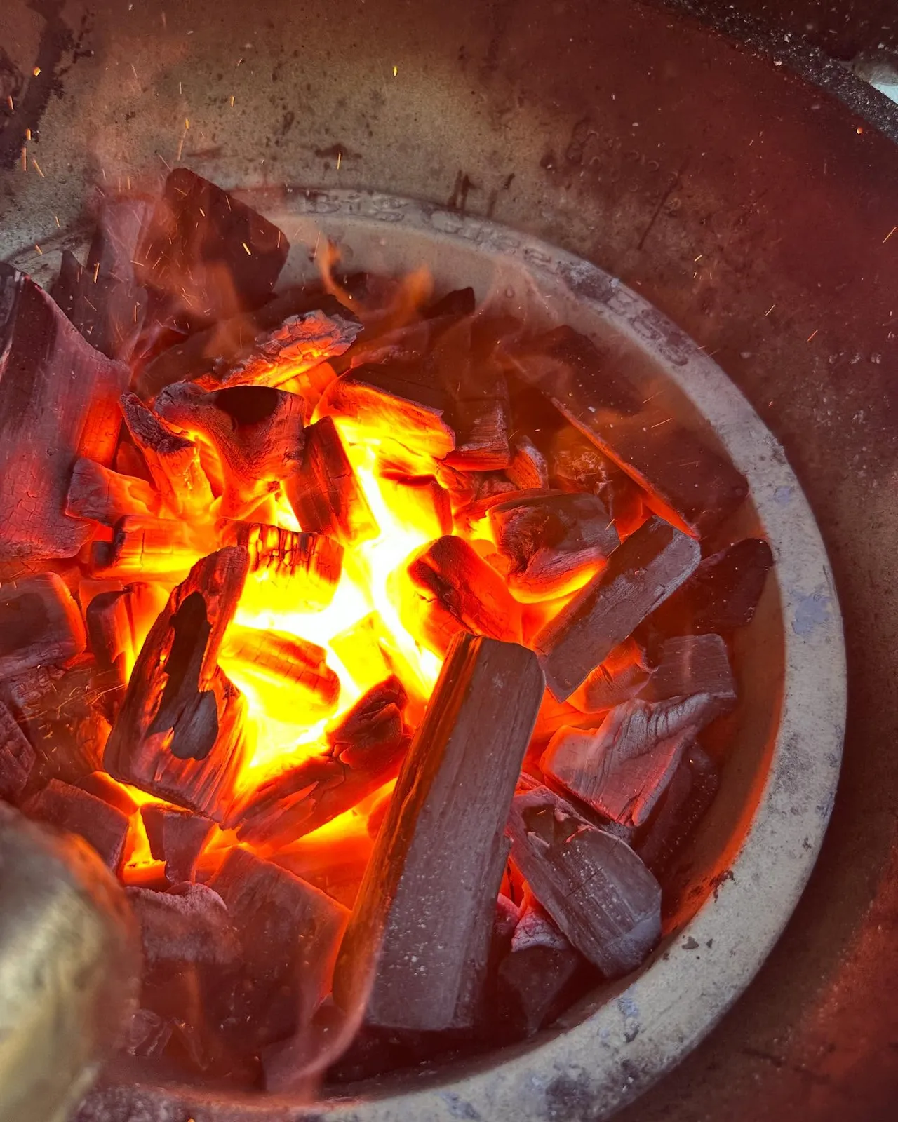 Glowing charcoal for caveman-style grilling