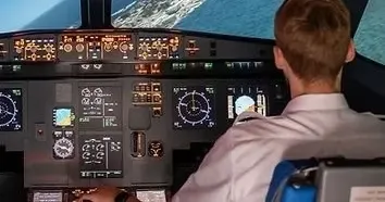 A person inside an A320 flight simulator