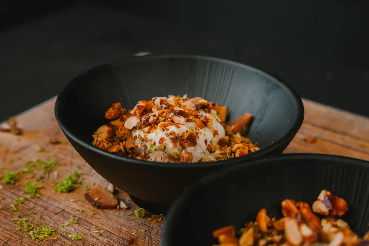 Asian noodle dish served in black bowls