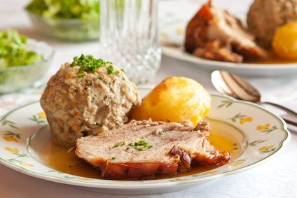Bavarian roast pork with a bread dumpling, potato dumpling and gravy