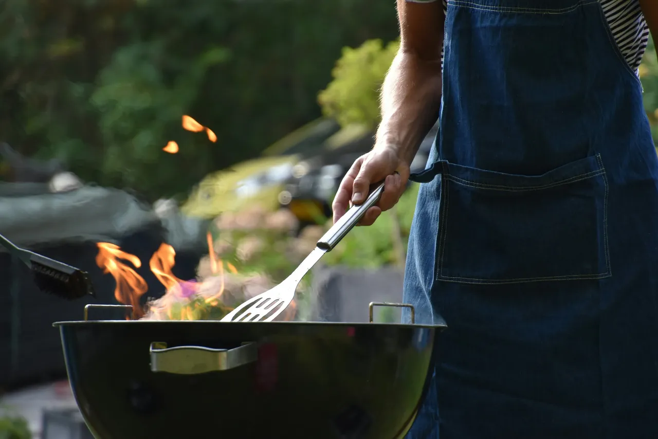 A man grilling outdoors
