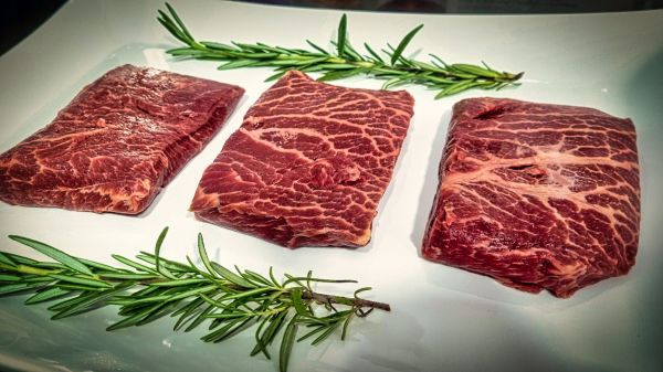 Raw meat pieces with rosmary