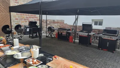 An outdoor bbq location prepared for a cooking class