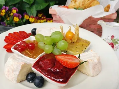 A plate with cheese and jams