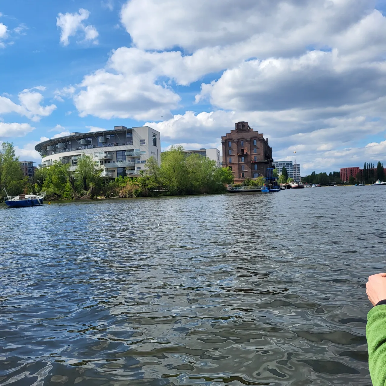 Historic brick warehouse beside modern flats on the shore of Rummelsburg Bay in Berlin