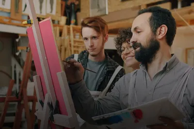 Art, culture & creative experiences: students painting at easels with their instructor