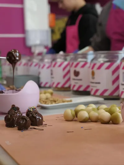 Chocolates being coated with chocolate