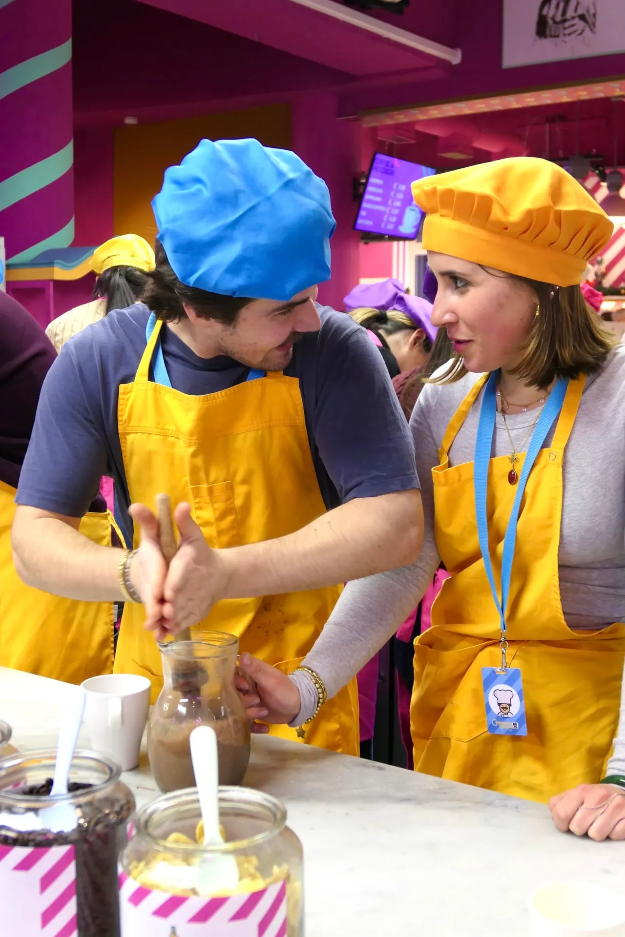 Two people preparing a chocolate cream