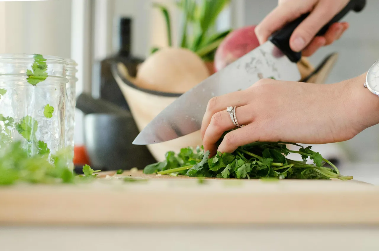 A person cutting herbs