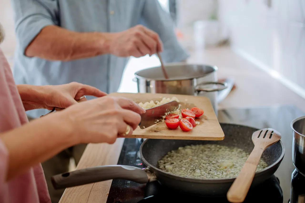 Two people cooking together
