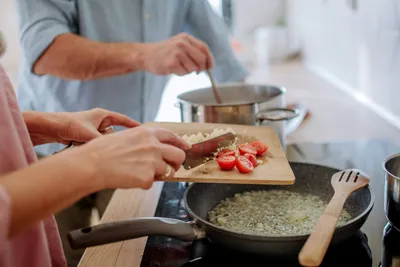 Two people cooking together