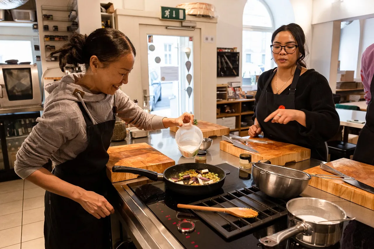 Two woman preparing a sauce