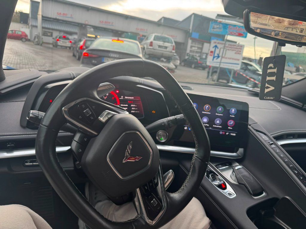 Cockpit of a Corvette C8 Z51 Stage 2 with leather steering wheel and digital instrument display