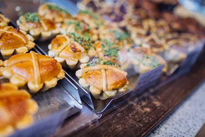 Freshly baked lattice-topped pastries in a bakery display in Leipzig