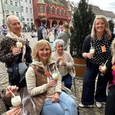 A group of people with drinks in their hands