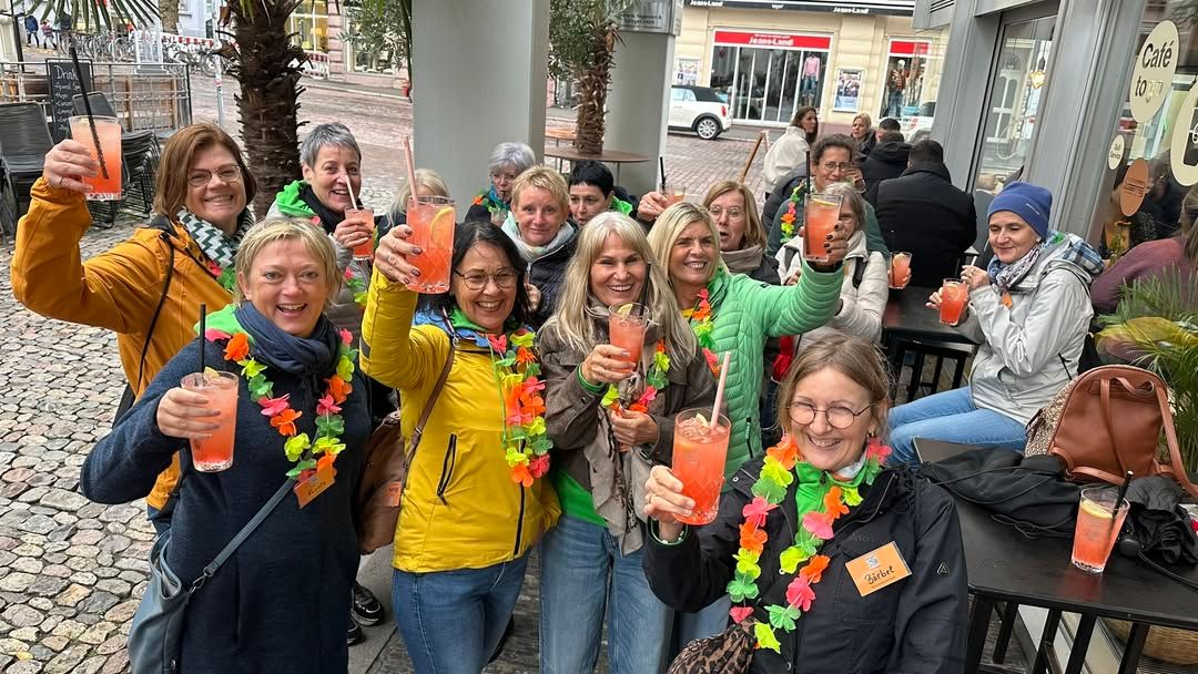 A group of people with drinks in their hands