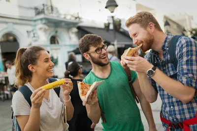 Three people enjoying food together