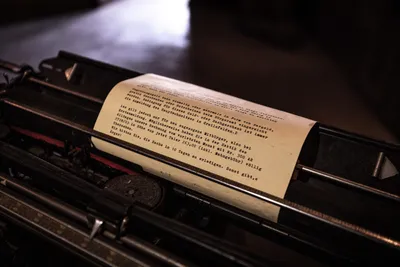 Image of a paper coming out of a typewriter