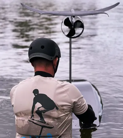 A man in the water with an eFoild board