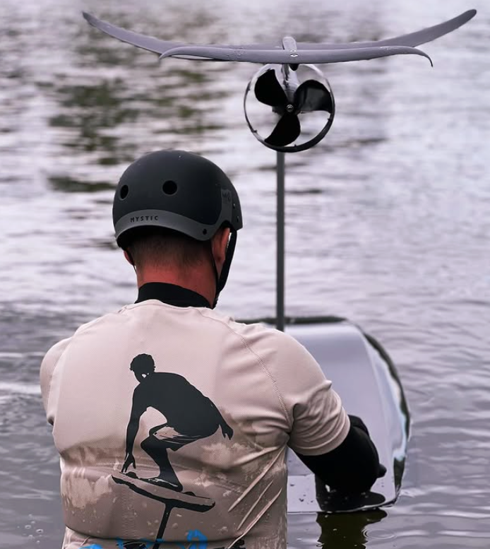 A man in the water with an eFoild board