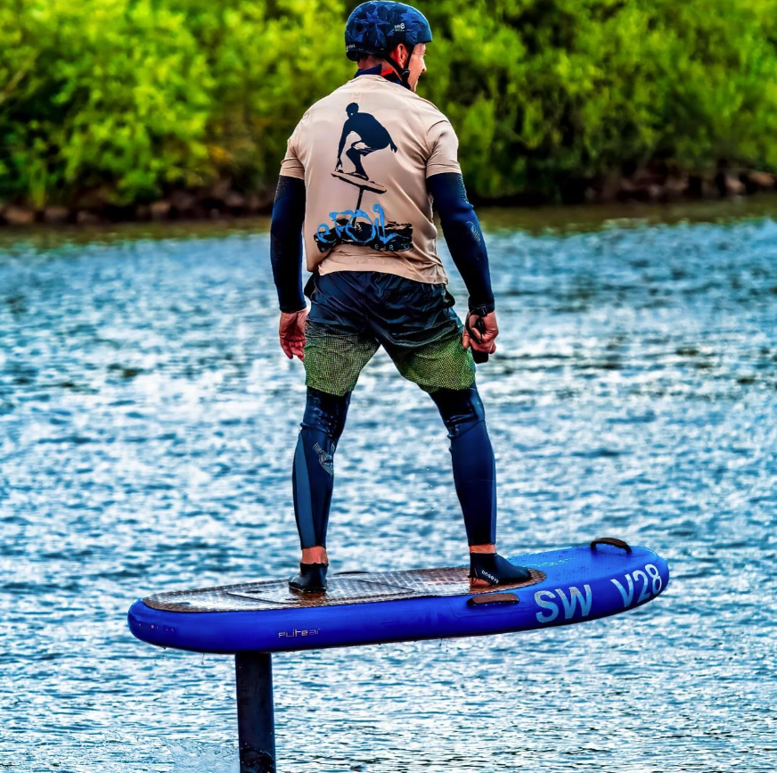 A man standing on a eFoil board