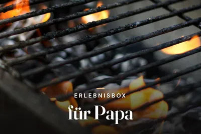 Experience gift box for dad – glowing charcoal beneath a barbecue grill grate