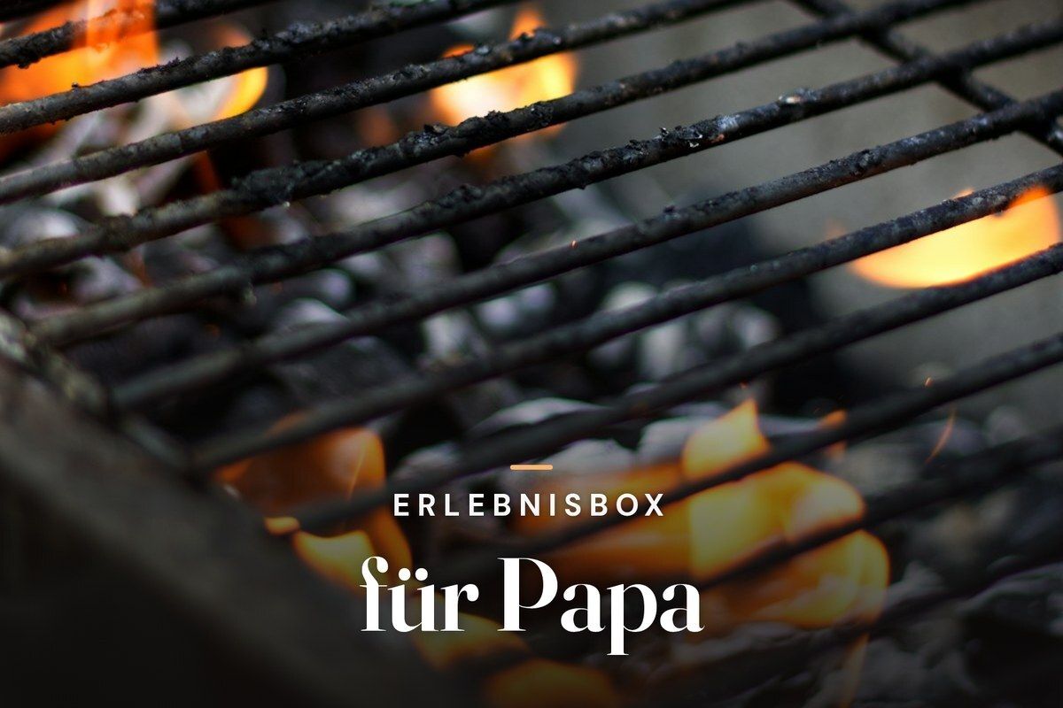 Experience gift box for dad – glowing charcoal beneath a barbecue grill grate