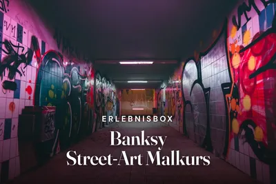 Underground passage covered in colourful graffiti and lit in pink and purple, with the title "Erlebnisbox Banksy Street-Art Malkurs".