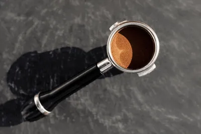 A shot of espresso prepared for a manual coffee machine
