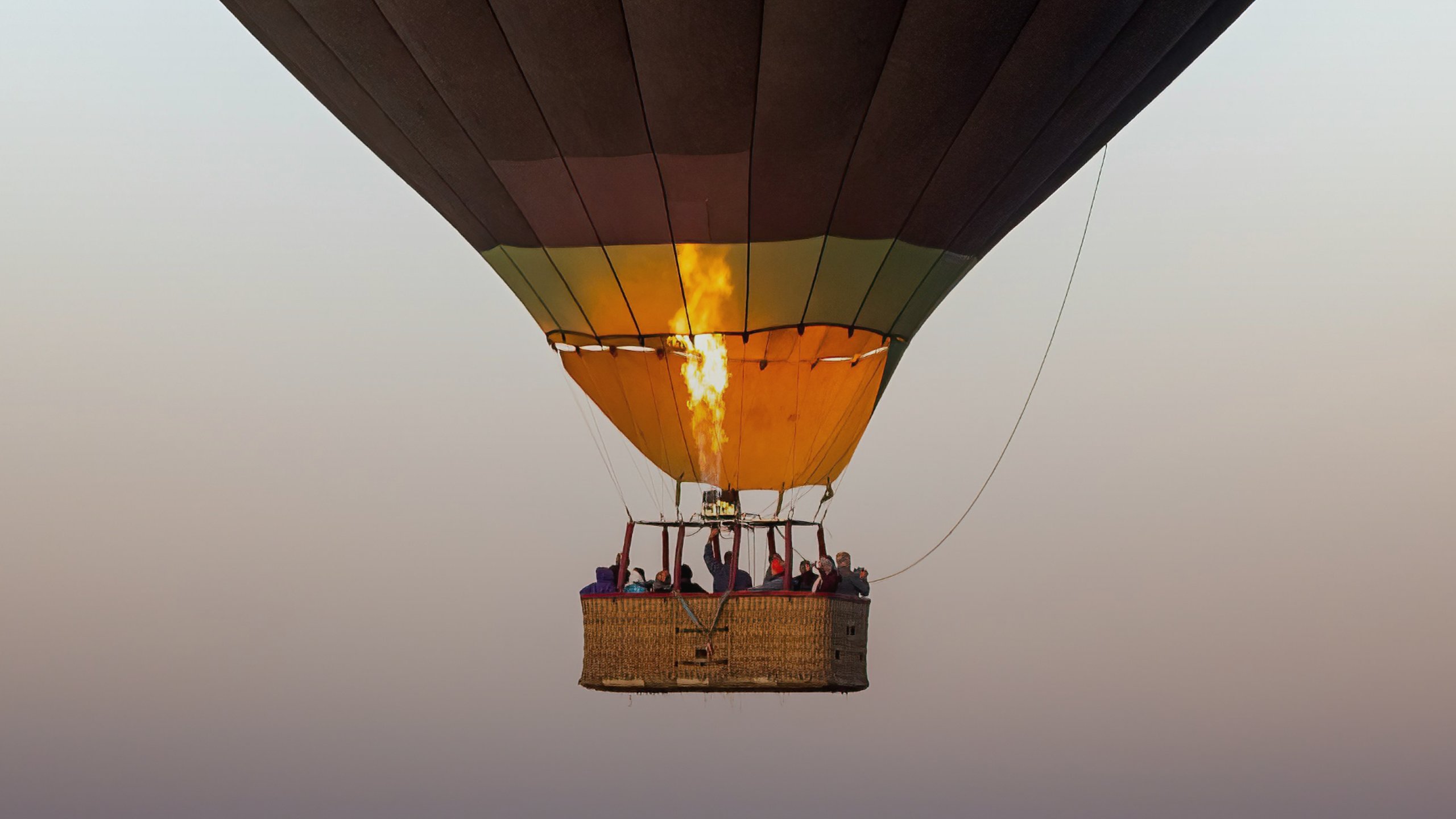 A hot air balloon flying in the evening sky