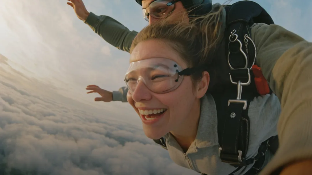 Two people laughing during a skydive