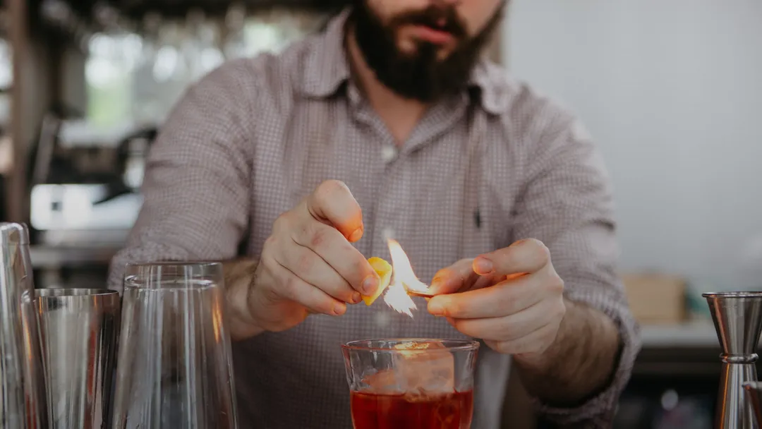 A barkeeper preparing a cocktail