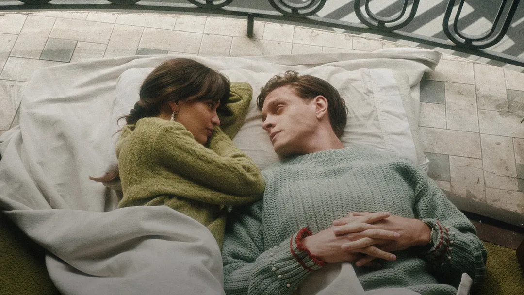 A couple laying next to each other