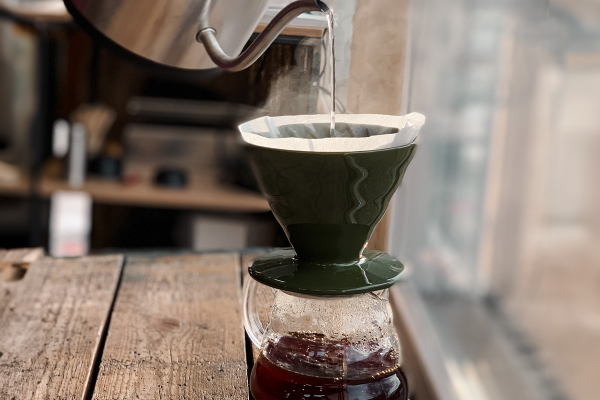 Someone brewing filter coffee with manual filter method