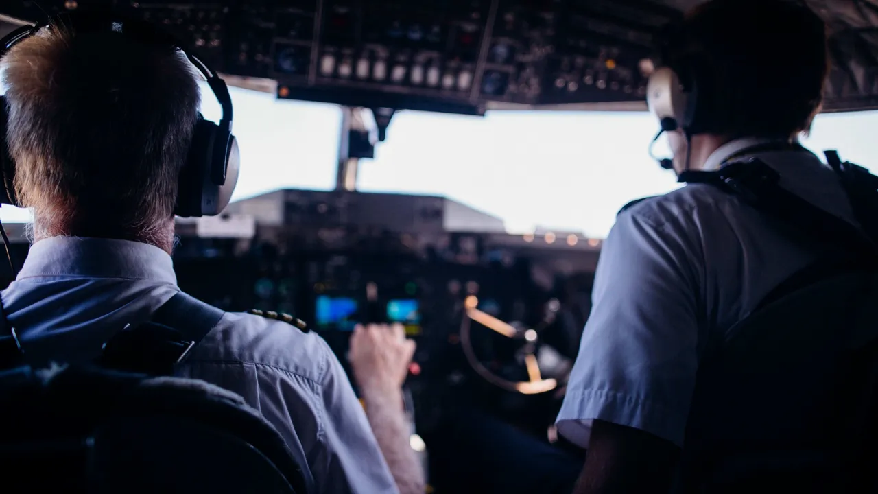 Two people flying an airplane