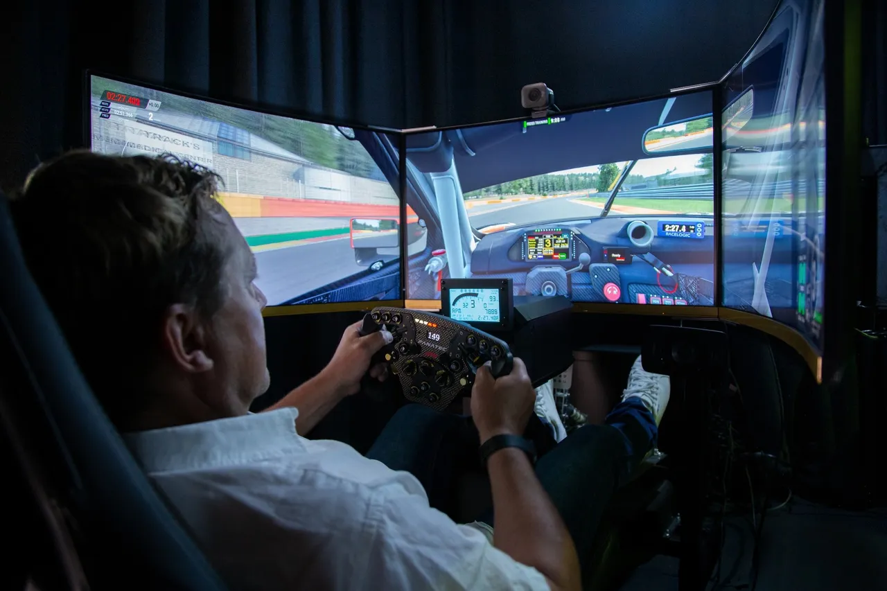 Man inside a Full motion racing simulator