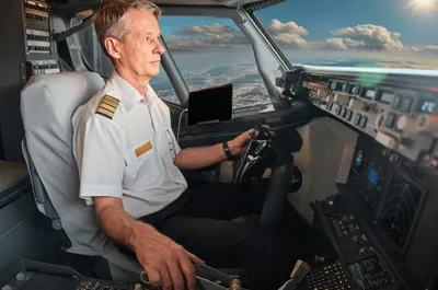 A pilot in a airplane cockpit