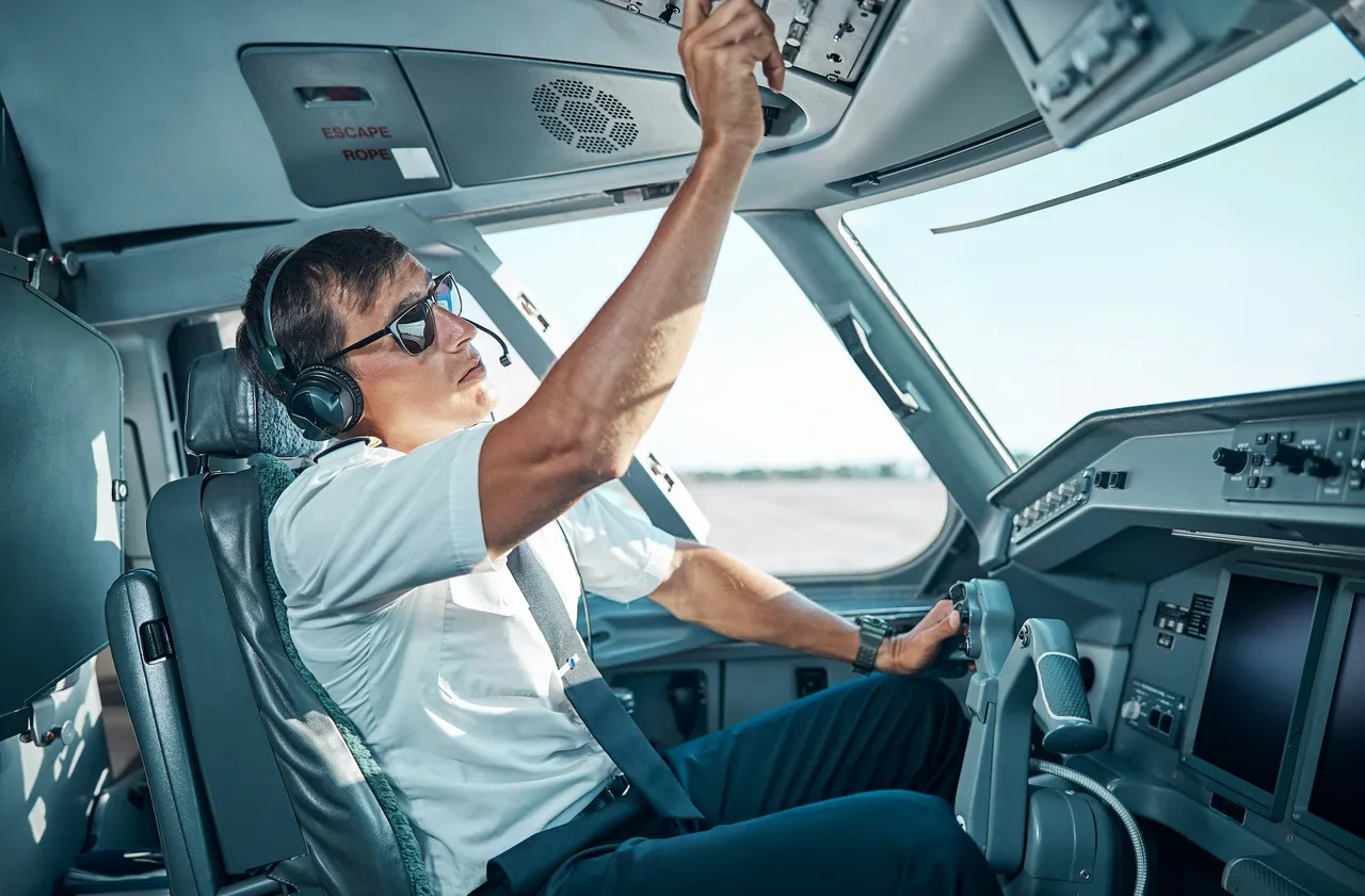 Man inside the cockpit of an airplane