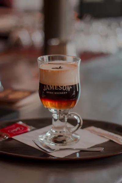 A glas with Irish Coffee.