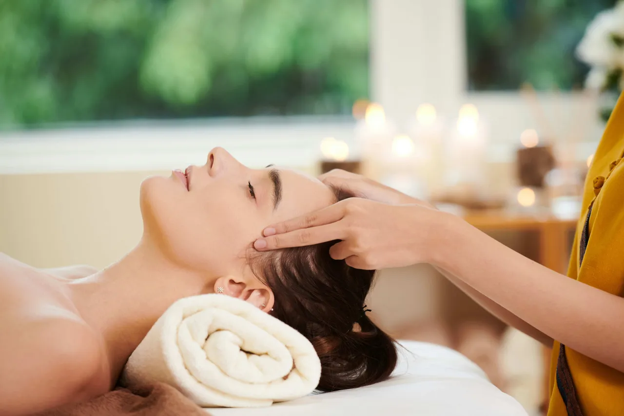 A person getting a head massage