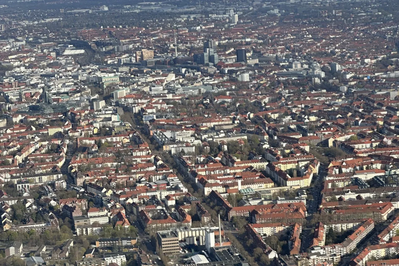 Aerial view over the rooftops and green parks of Hanover from a helicopter