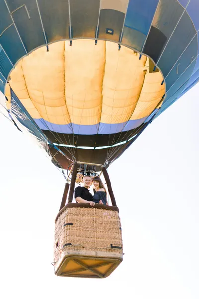 A couple in a hot air balloon