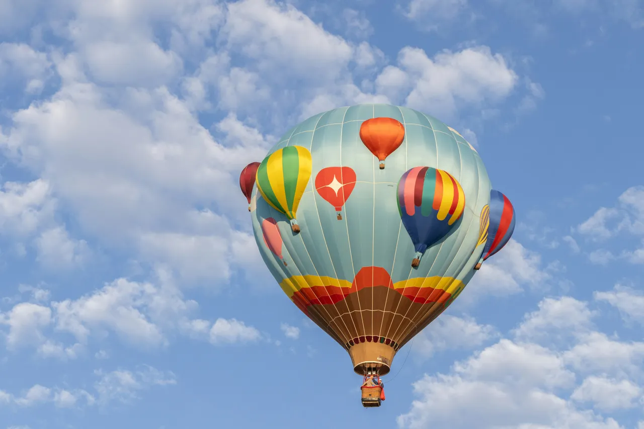 3 colourful hot air balloons flying