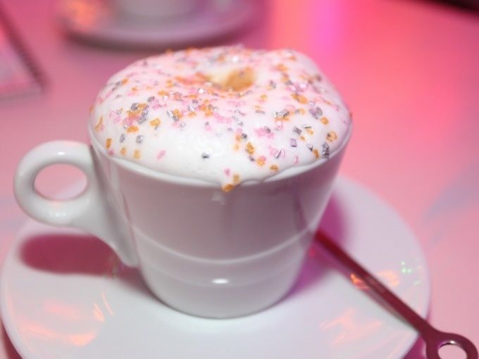 A cup of cappuccino with sparkling topping