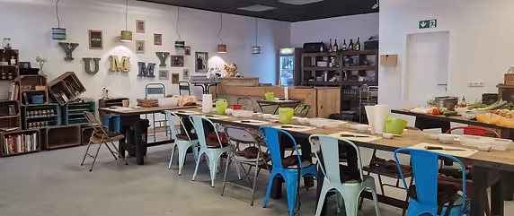 View of a table with colourful chairs