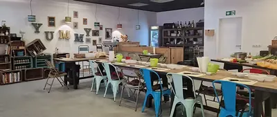 View of a table with colourful chairs
