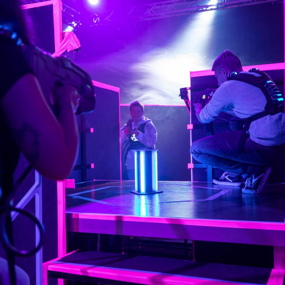 Three people playing lasertag