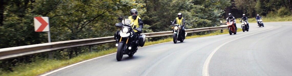 A group of motorbikers on a curvy street