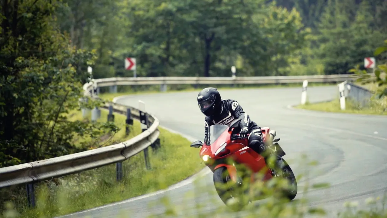 Person riding a motorbike in a curve